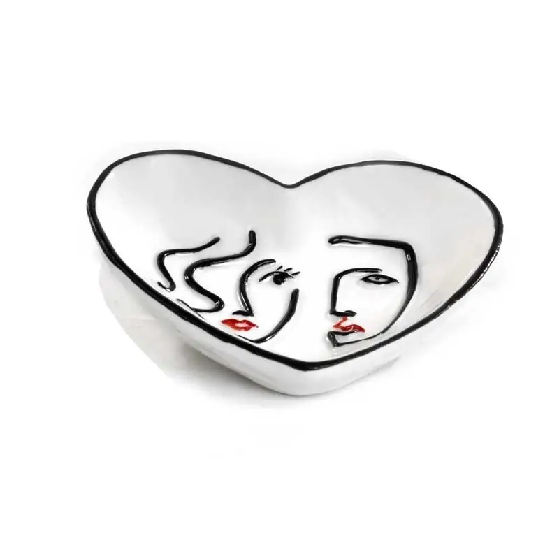 svuotatasche a forma di cuore in porcellana con decoro viso